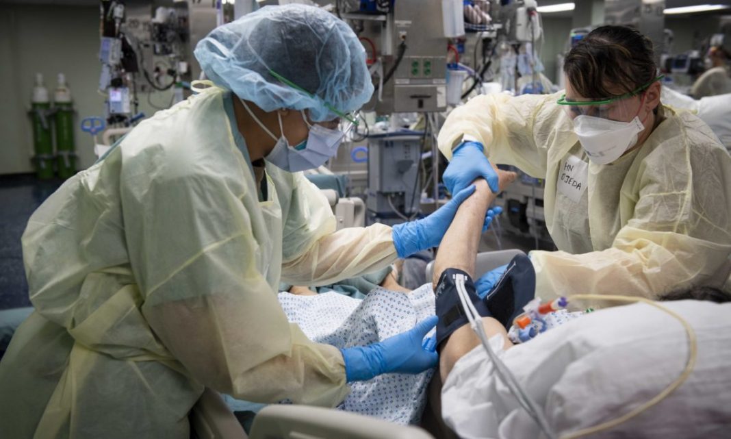 U.S. Navy Doctors, Nurses and Corpsmen Treat COVID Patients in the ICU Aboard USNS Comfort